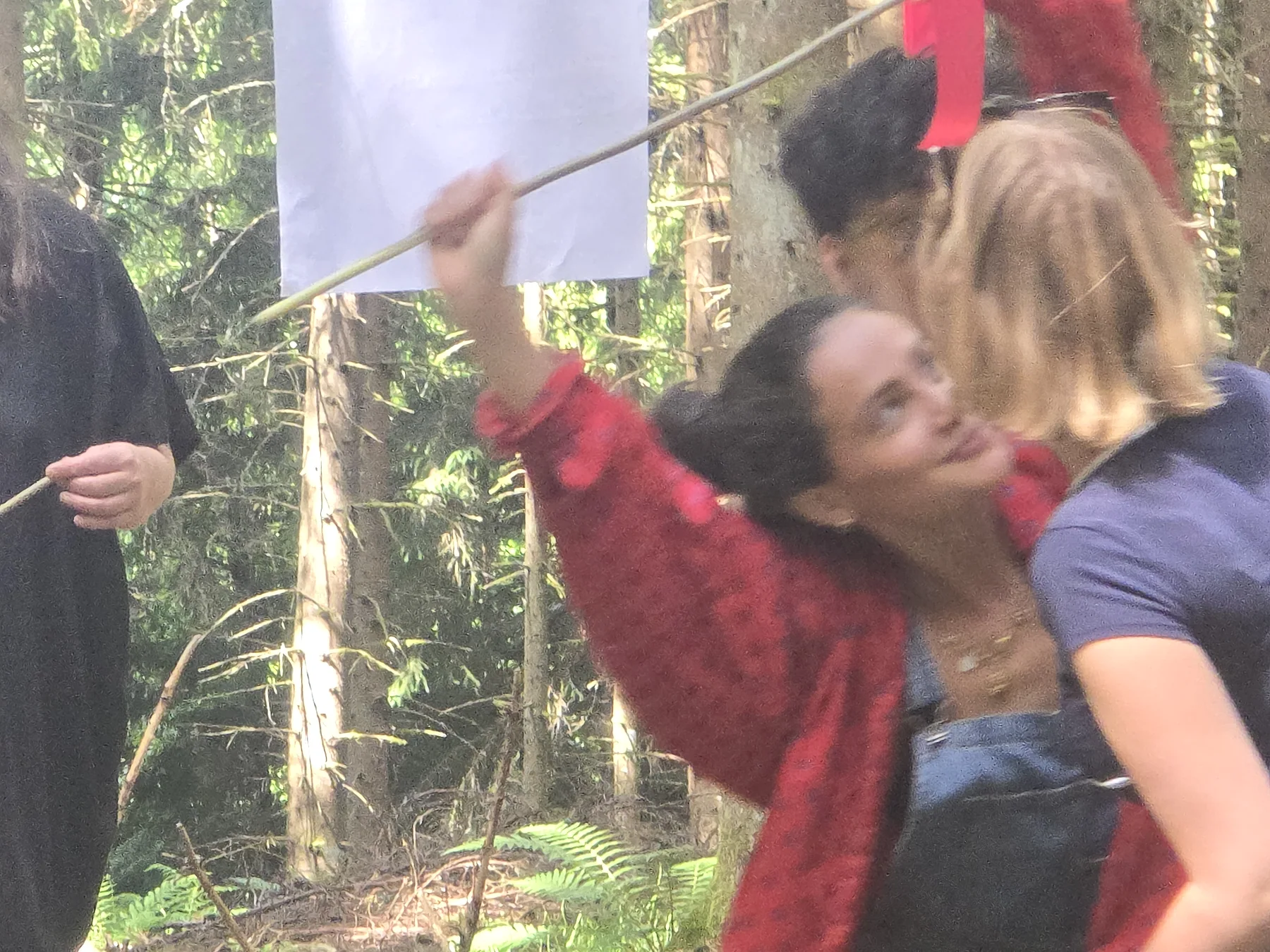 Performers improvising physical relationships in the woods